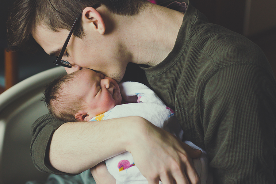 close-up-man-kissing-newborn-baby
